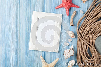 Sea vacation with blank photo frame, star fish and marine rope Stock Photo