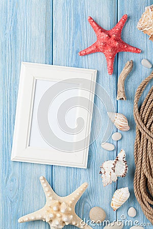 Sea vacation with blank photo frame, star fish and marine rope Stock Photo