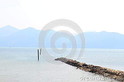 The sea is very calm with gentle ripples. Background of sky and sea Stock Photo
