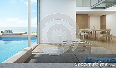 Sea view living room and dining room in modern pool house Stock Photo