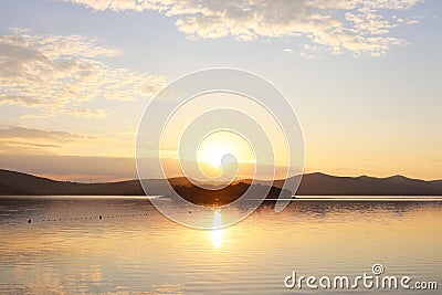 The sea water area is intended for bathing holidaymakers fenced with buoys for safety. Rest on the water in the early morning. Sun Stock Photo