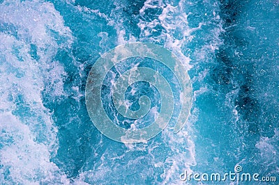 Sea water with foamy surface. Tropical islands boat travel. Cruise ship trail. Blue boiling ocean water top view. Stock Photo