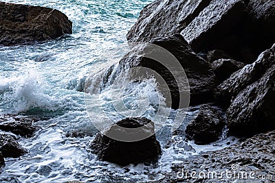 Sea water hits the rocks Stock Photo