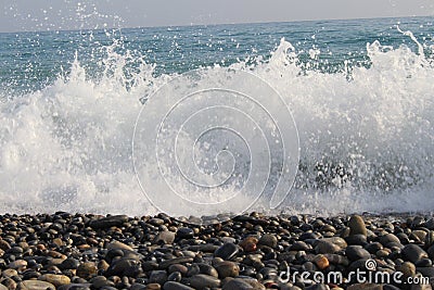 sea wave breaks up into a spray Stock Photo