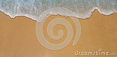 Sea wave hits on sand shore Stock Photo