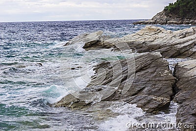 Sea waves crushing on rocks Stock Photo