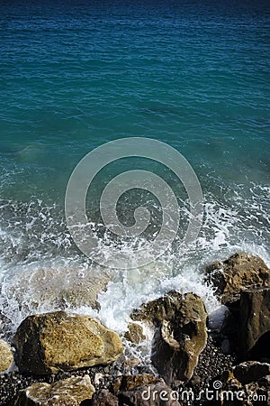 Sea waves hit stony seashore Stock Photo