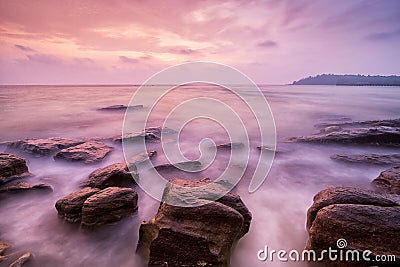 Sea waves lash impact rock Stock Photo