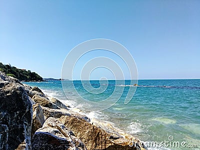 Sea waves pounding the stones on the shore Stock Photo