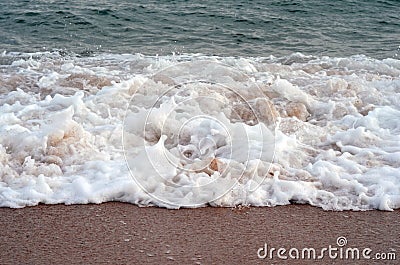 Sea waves and sandy beach Stock Photo