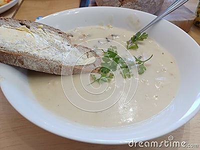 Seafood chowder with soda bread served in a white bowl Irish meal Stock Photo