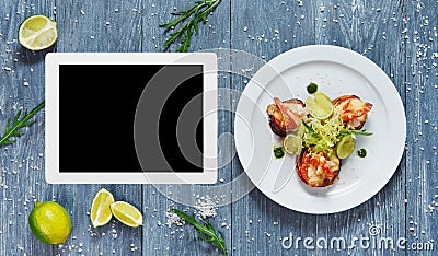 Seafood dish top view with copy space at tablet Stock Photo