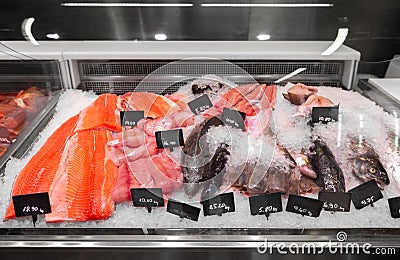 Seafood in fish shop fridge display case Stock Photo