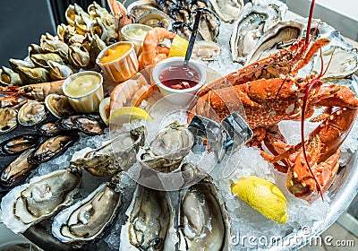 Seafood plate. Different molluscs and crustaceans lay over ice Stock Photo