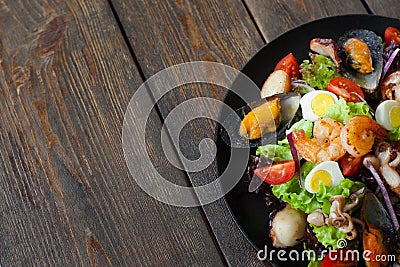 Seafood salad plate on wood half image copyspace Stock Photo