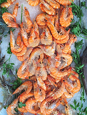 Seafood stall on a provencal market featuring raw tiger prawns a Stock Photo