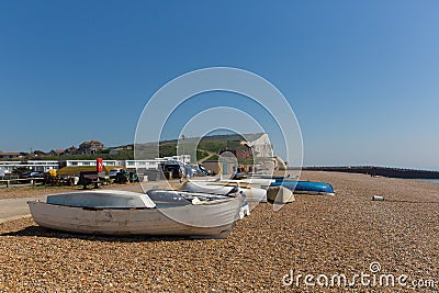 Seaford East Sussex beach, boats and white chalk cliffs Editorial Stock Photo