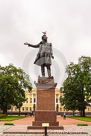 Seagull sits on the head of the monument to Alexander Pushkin on the square in front of the Russian Museum in St. Petersburg, Editorial Stock Photo