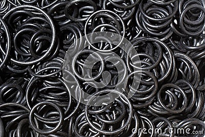 Seal O-ring black rubber. Sealing NBR gaskets for hydraulic system. Chemical resistant Spare part. Industrial background Stock Photo