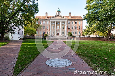 The seal on the University of North Carolina on brick walkway leading to the South Building Editorial Stock Photo