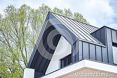 Seam metal roof with hidden eaves gutter Stock Photo