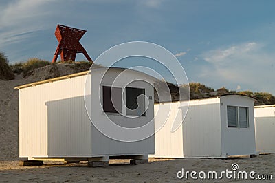 Beach cabins with seamark in sand dunes Stock Photo