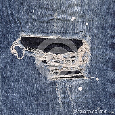 Seamless blue denim cotton jeans ripped fabric texture background Stock Photo