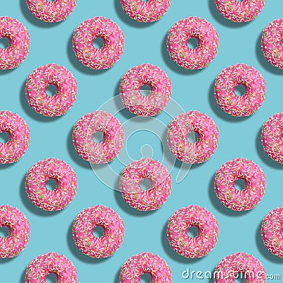 Seamless diagonal pattern with glazed strawbarry pink donuts and turquoise background. Pastel colors. Confectionery banner Stock Photo
