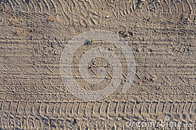 Seamless dirt road texture background. Tracks of cars on the san Stock Photo