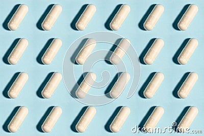 Seamless medical pill, pharmaceutical medicine capsule pattern. Painkiller, vitamin, antibiotic, probiotic on blue background Stock Photo