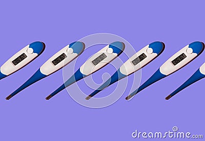 Seamless pattern of electronic thermometers with a normal human body temperature of 36.6 on a blue background Stock Photo