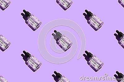 Seamless pattern of liquid oil serum bottle isolated on violet background. Retinol, aha acid, collagen skincare fluid in Stock Photo