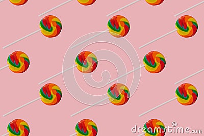 Seamless pattern of rainbow lollipop on a pink background Stock Photo