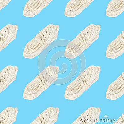 Seamless pattern of a skein of white rope on blue background Stock Photo