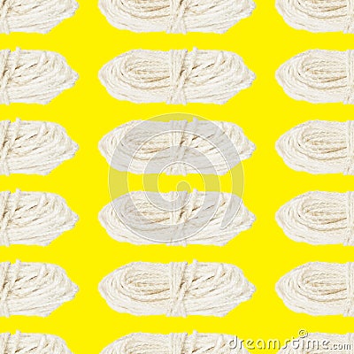 Seamless pattern of a skein of white rope on a yellow background Stock Photo