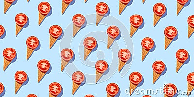 Seamless pattern of stylish mockup with tomato in an ice cream waffle cone on a pastel blue background. creative healthy Stock Photo