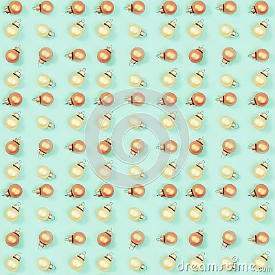 Seamless regular creative pattern with gloden shiny small Christmas balls on mint colored paper Stock Photo