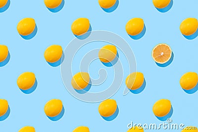 Seamless regular pattern with fresh lemons on a blue background. Hard light. Minimal summer composition Stock Photo