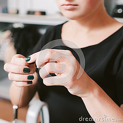 Seamstress professional career threading needle Stock Photo