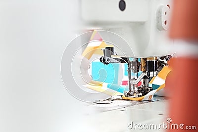 Sewing room, seamstress sews clothes on a sewing machine Stock Photo