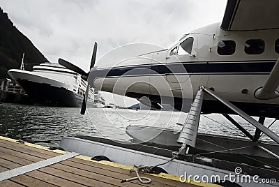 Seaplane and cruise ships docked along the pier in Alaska Stock Photo