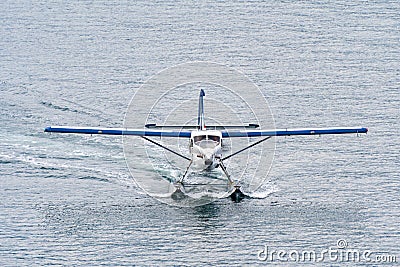 Seaplane/ Float plane motoring on water Stock Photo