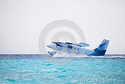 Seaplane is landing on water Editorial Stock Photo