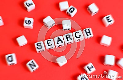 Search concept with cubes `Search` word and other defocused cubes. Stock Photo