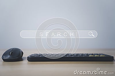 Search engine icon bar website with mouse and wireless computer keyboard on the table for searching information from internet , Stock Photo