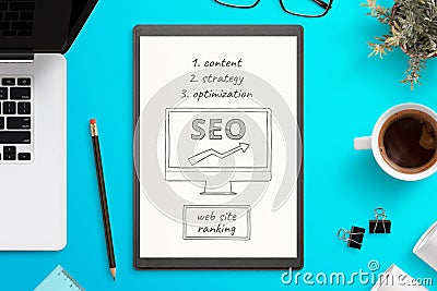 Search engine optimization sketch on white paper. Office desk, top view composition Stock Photo