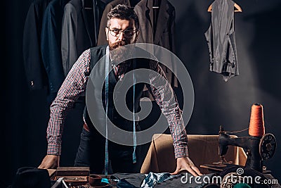 In search of inspiration. Bearded man tailor sewing jacket. business dress code. Handmade. retro and modern tailoring Stock Photo