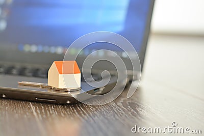 Searching and finding a new home online on internet using a computer Stock Photo