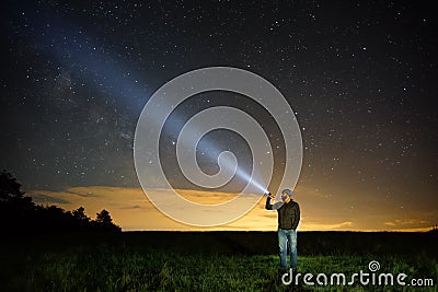 Searching with flashlight in outdoor Stock Photo