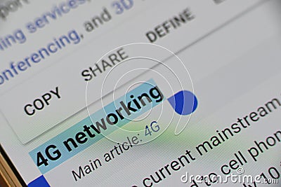 Word `4G Networking` selected and highlighted digitally on mobile display screen Stock Photo